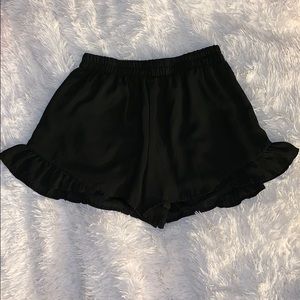 Black ruffled shorts